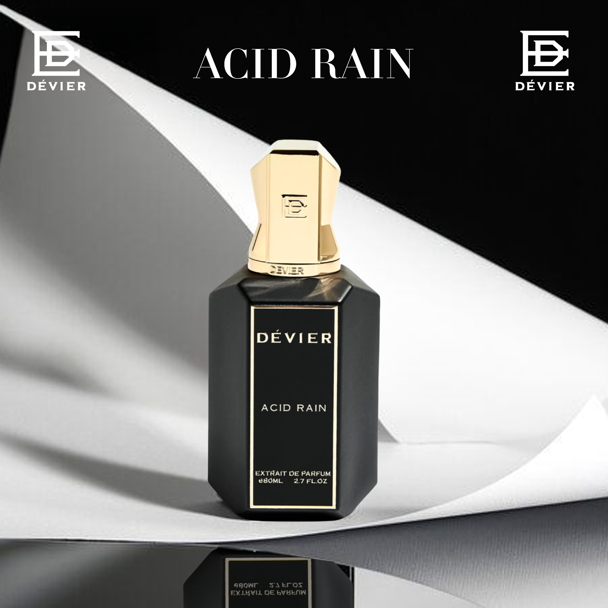 A striking black-and-gold bottle of Dévier “Acid Rain” stands on sleek reflective paper folds — blending modern minimalism with a bold, luxurious edge.
